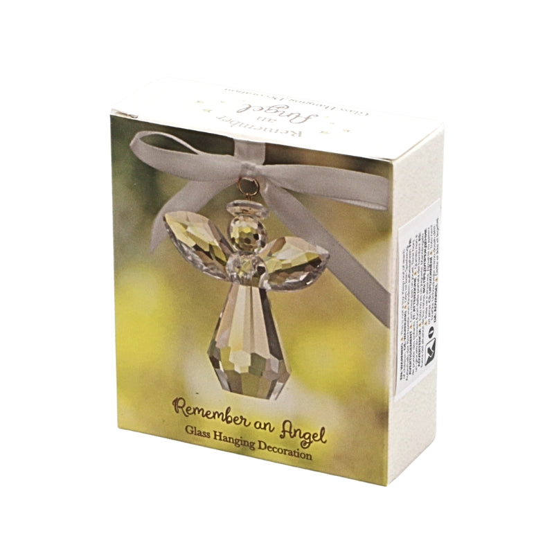 A boxed angel hanging decoration with a faceted clear glass angel figure tied with a gray ribbon, shown on a white background.