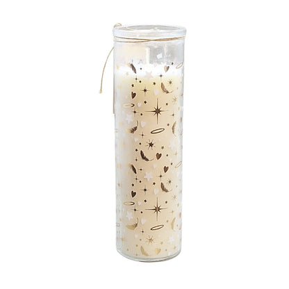 A tall glass jar candle filled with cream-colored wax and decorated with a celestial pattern of gold and brown stars, moons, and hearts, complete with a small hanging string.