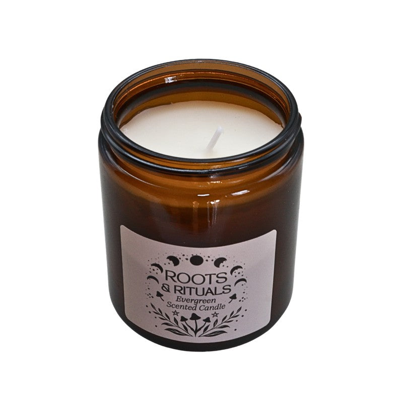 Amber glass candle with a label on a white background