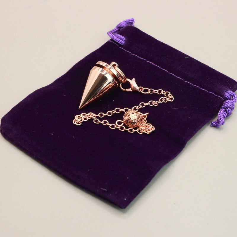 Rose Gold Pendulum On Purple Velvet Bag