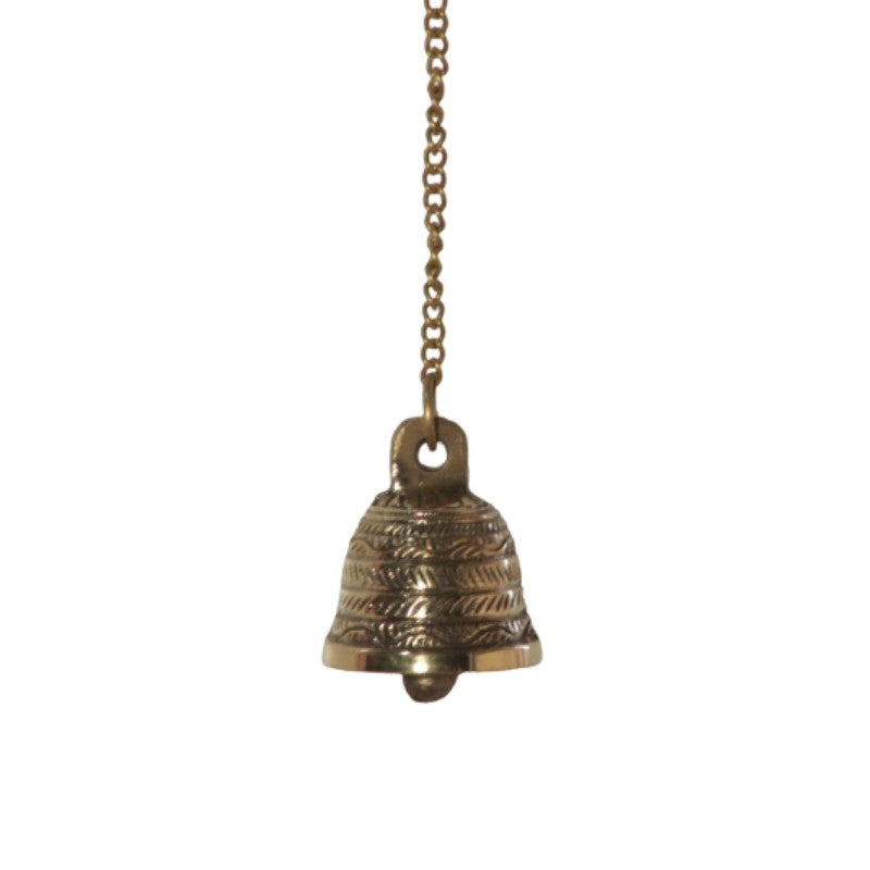 Gold coloured embellished brass bell hanging from  chain