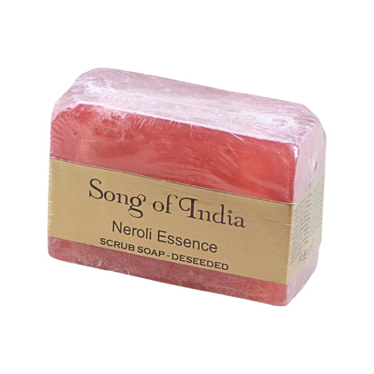 A rectangular bar of pink soap wrapped in clear plastic and a beige paper label that reads 'Song of India Neroli Essence SCRUB SOAP - DESEEDED' on a plain white background.