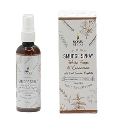 bottle of white sage and cinnamon room spray next to box