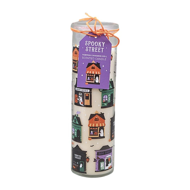 glass jar candle with colourful house and ghost designs on a white background