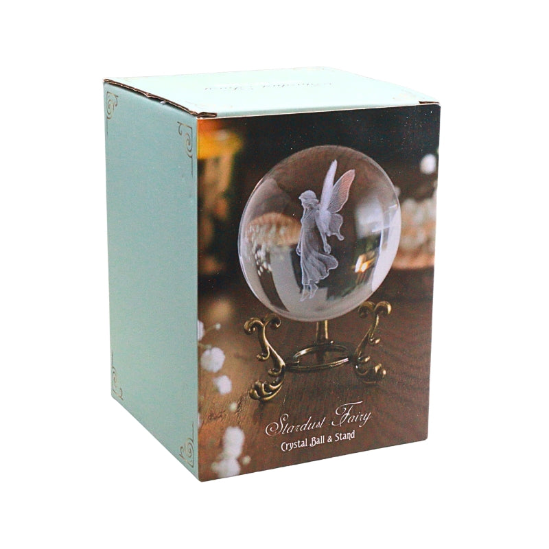 Box featuring an image of a glass crystal ball with a fairy image inside on a gold stand
