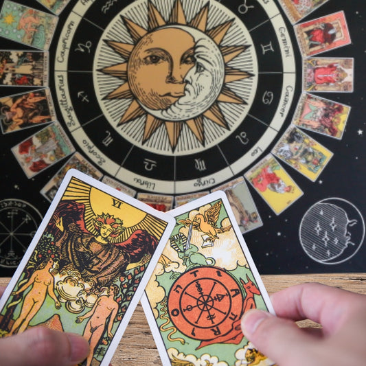 TAROT CARDS BEING DEALT ONTO A TAROT CLOTH