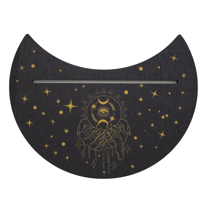 black tarot card holder (flat piece of wood designed to hold a card upright) decorated with stars and a hand holding a crystal ball