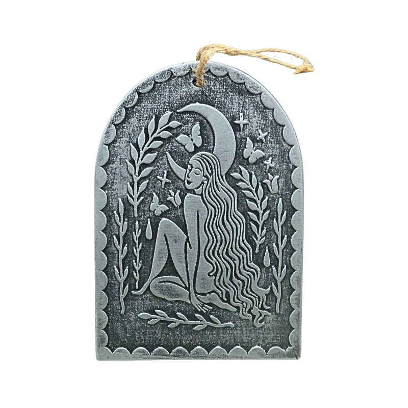 silver terracotta plaque with an image of a female under a crescent moon