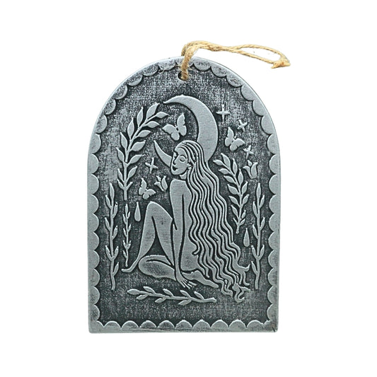 silver terracotta plaque with an image of a female under a crescent moon