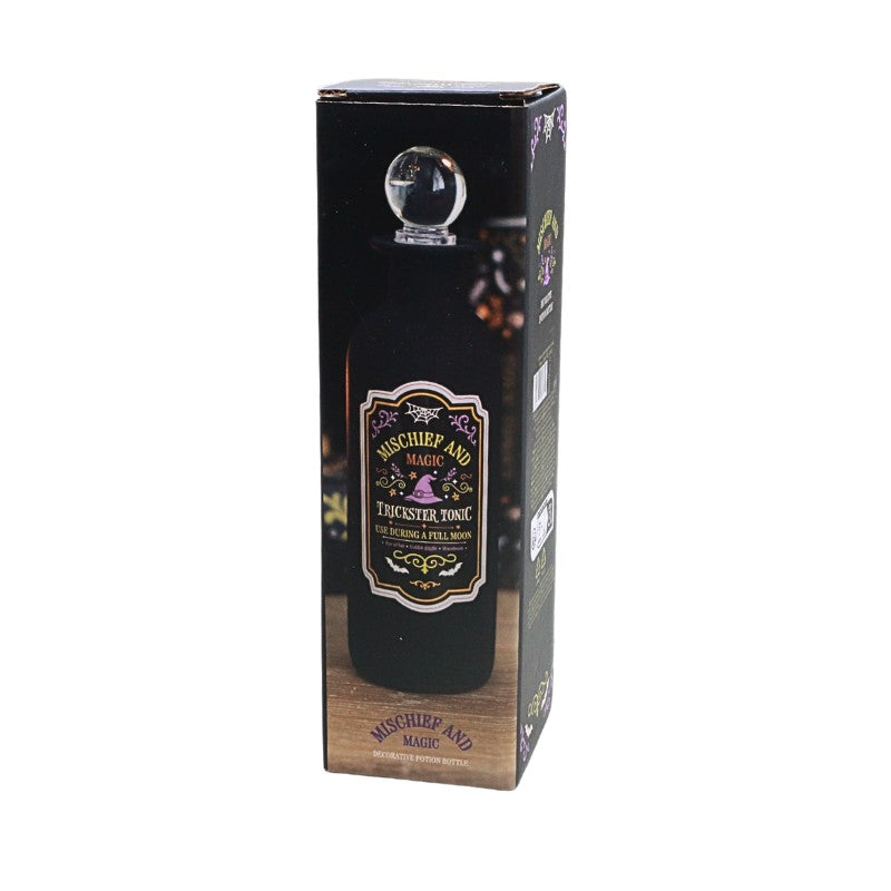 decorative box showing a black bottle with round glass stopper and a green and purple spooky design label with witches hat design