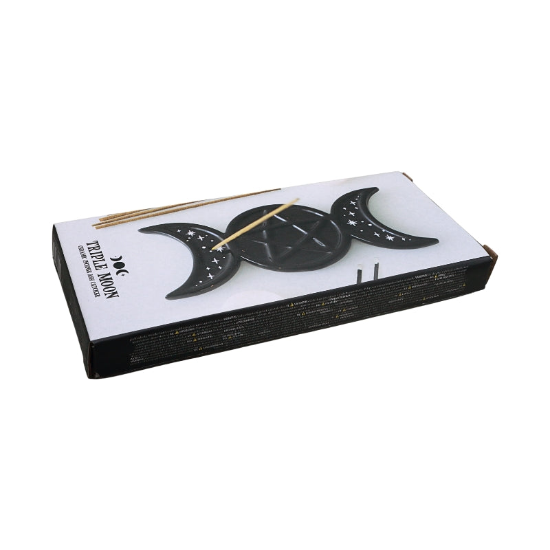 A boxed set of Triple Moon Incense holder, featuring a white and black box with illustrations of the triple moon phases and a few incense sticks visible on top, set against a plain white background.