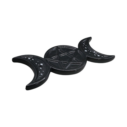 black ceramic glossy dish with two crescent moons beside a central pentacle design 