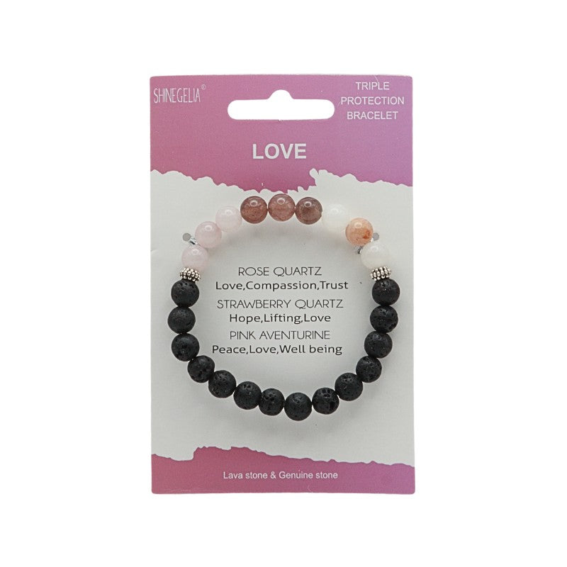 Black beaded bracelet on a pink and white packaging with text