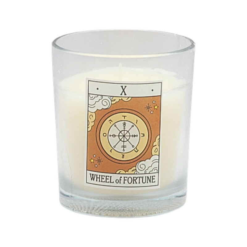 Candle in a glass holder with 'Wheel of Fortune' tarot card design on a white background