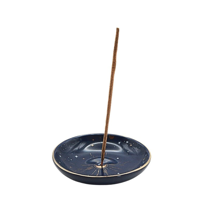 Blue incense burner with a single incense stick on a white background