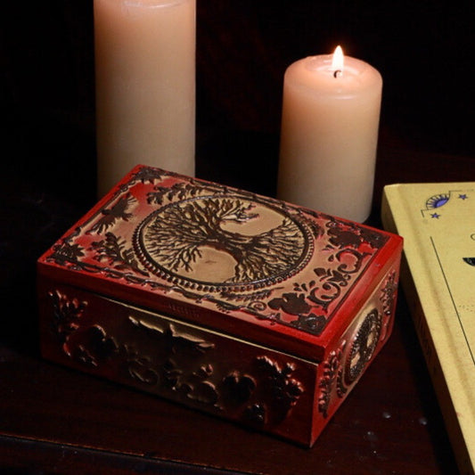 tree of life Tarot Card Storage Box with a pack of pocket sized rider waite tarot cards in front of beeswax candles
