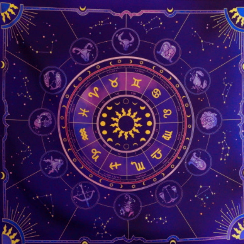 purple tarot cloth with astrological signs printed on it
