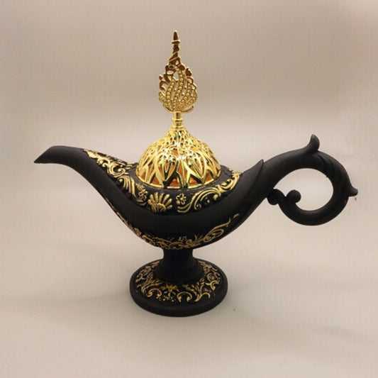 black and gold incense holder in the shape of an aladdin genie  lamp