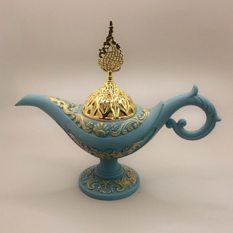 blue and gold incense holder in the shape of an aladdin genie  lamp