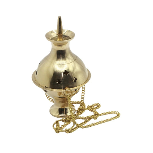 Gold-colored incense burner with chain on a white background