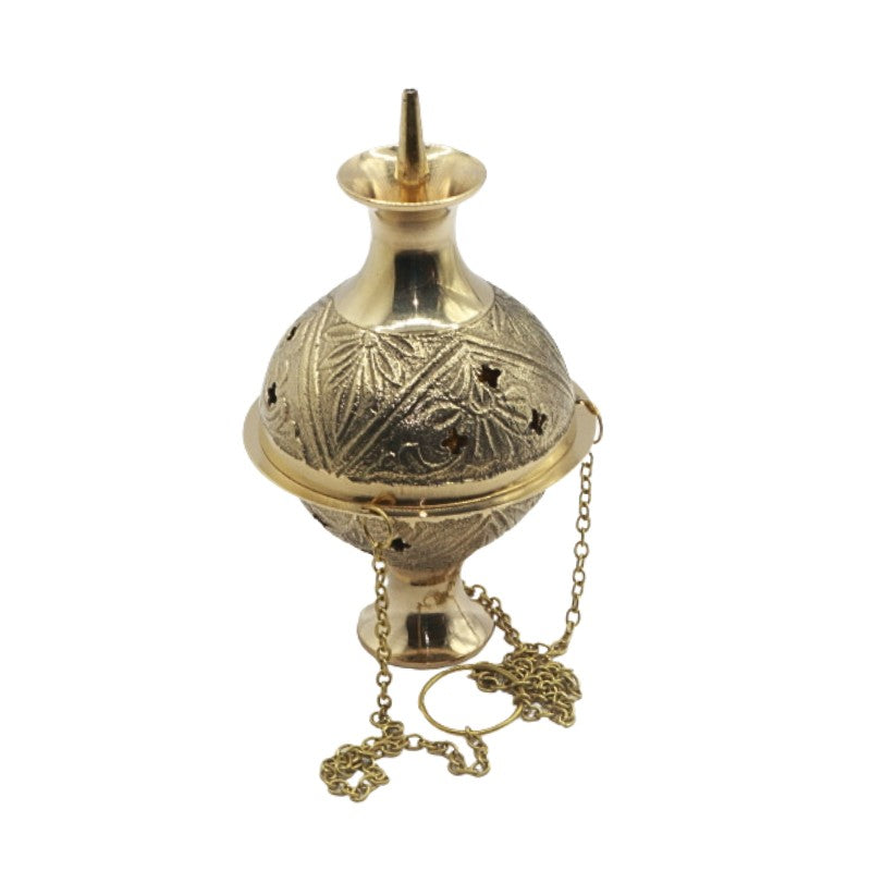 Decorative gold incense burner with chain on a white background