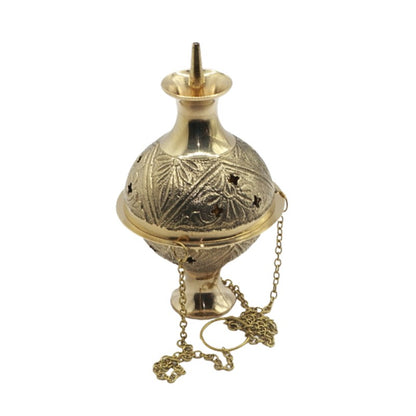 Decorative gold incense burner with chain on a white background