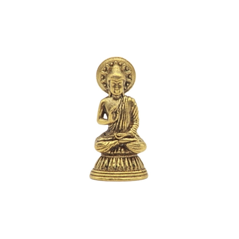 Brass  Buddha statue on a white background