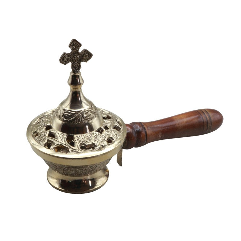 Decorative incense burner with wooden handle and metal top on a white background
