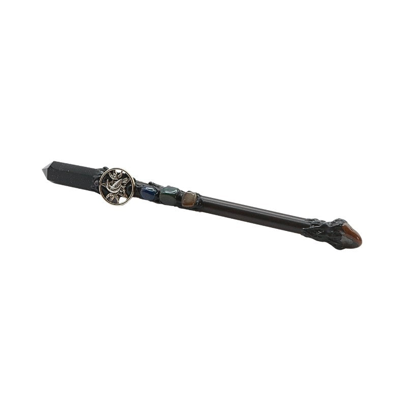 Decorative wand with intricate design on a white background