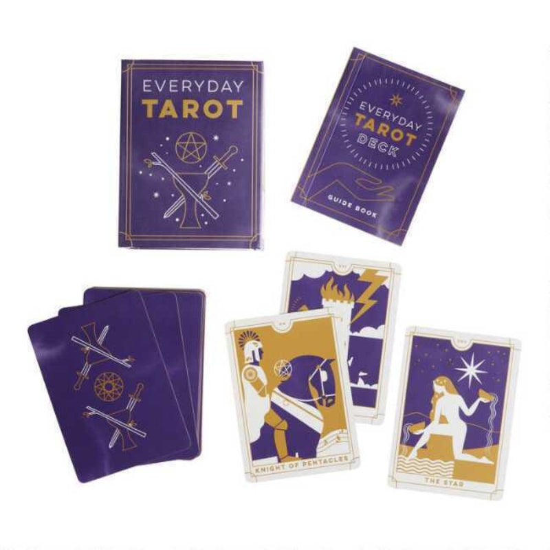 everyday tarot mini tarot deck   and cards laid out on table