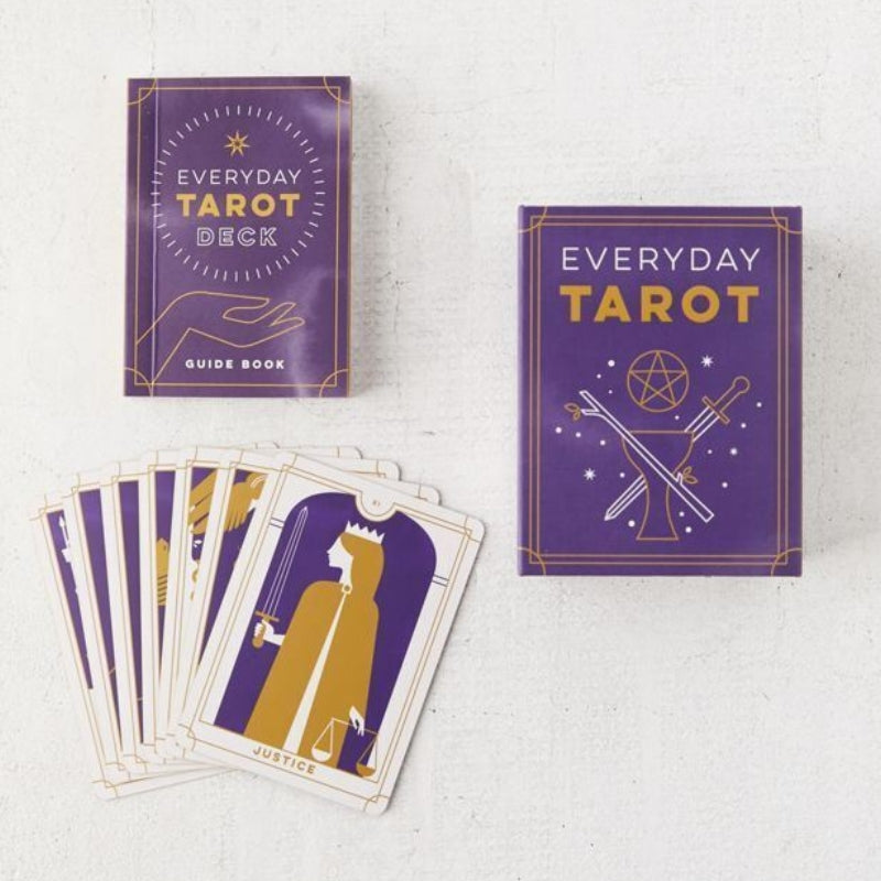 everyday tarot mini tarot deck  showing the guidebook with cards laid out on table