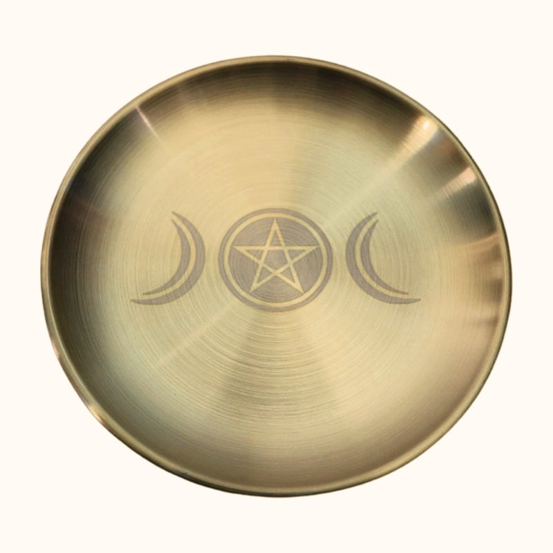 gold coloured plate used for offerings with the triple moon symbol etched on the front and pentacle within the missle circle