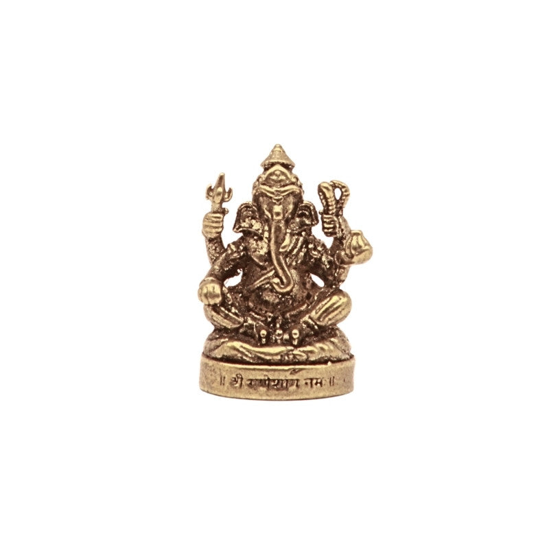 Brass statue of a deity - ganesh- on a white background