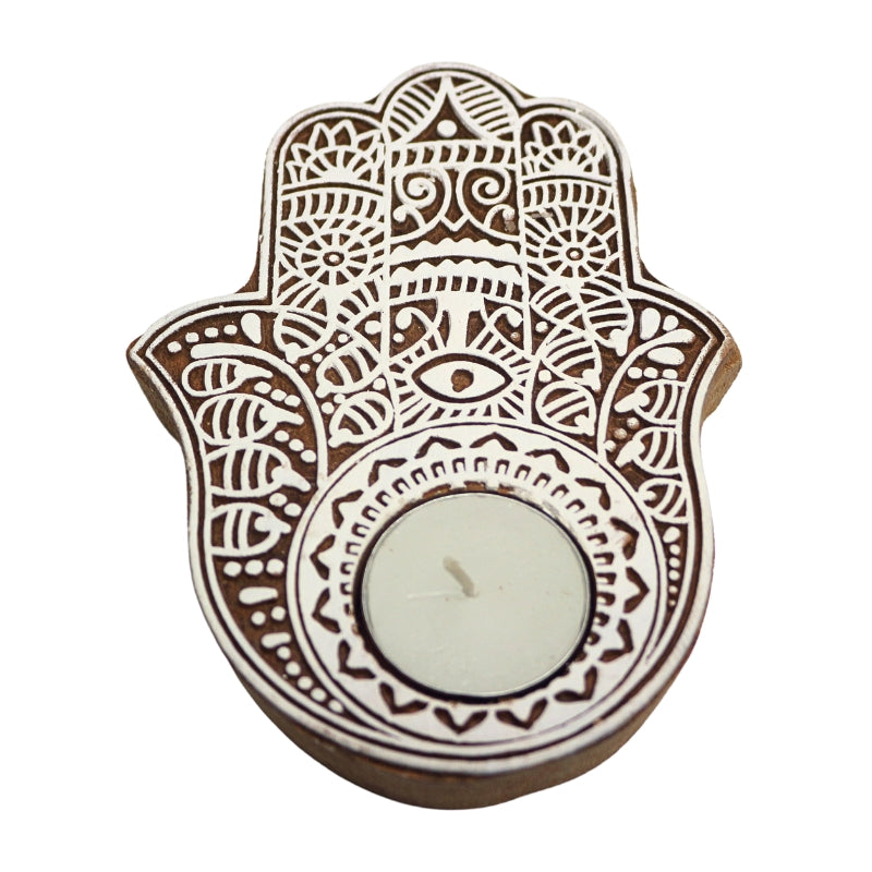 White patterned hamsa hand tealight and incense holder with a white tealight candle