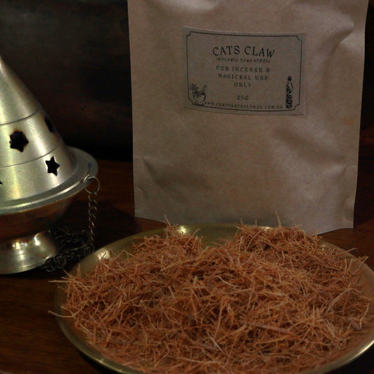 Cats Claw on a metal tray with a labeled bag in the background