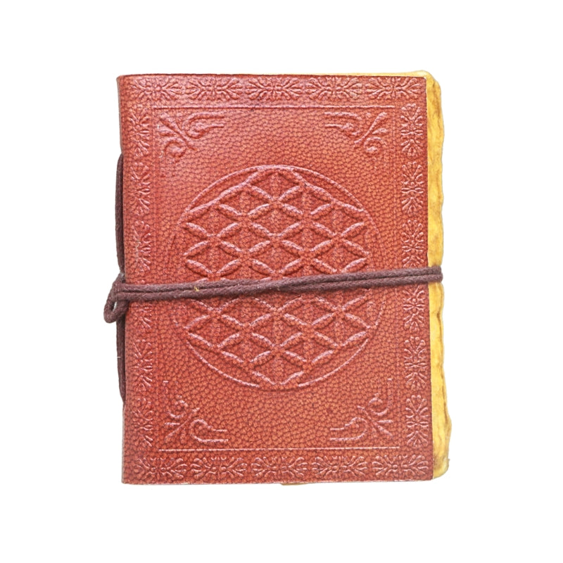 brown leather journal, embossed with image of a flower of life design, with a brown tie, on a white background