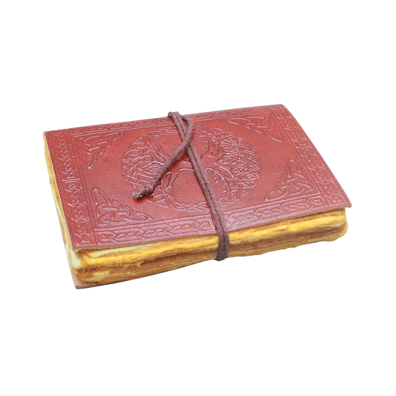 brown leather journal, embossed with image of a tree and celtic knots, with a brown tie, on a white background