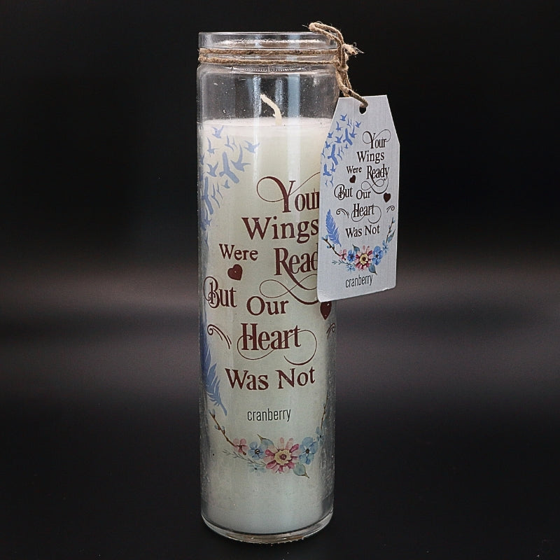 white cranberry scented memorial candle in a clear glass jar with a saying in gold on the front.