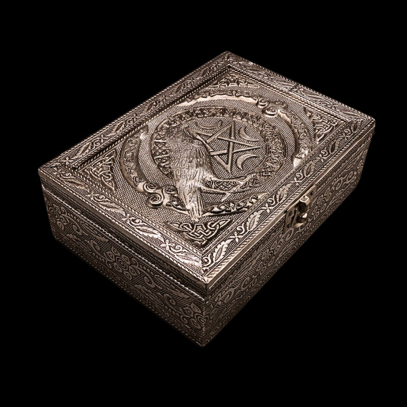 embossed metal tarot box with a raven on top