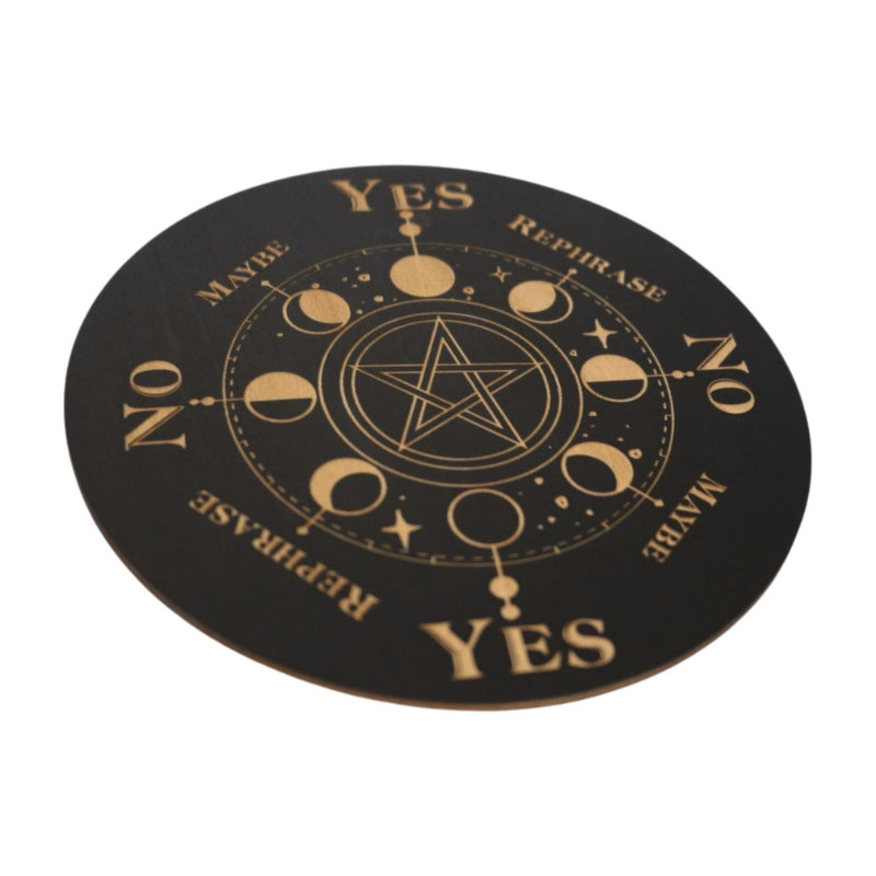 black round board for pendulum dowsing with the moon phases around a pentacle and yes, no, maybe and rephrase around the outer edge of the circle