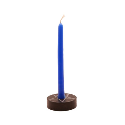 dark blue  tiny taper candle in a pentacle candle holder