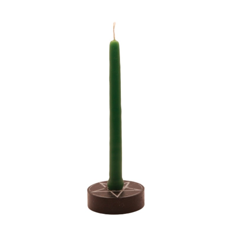 green  tiny taper candle in a pentacle candle holder
