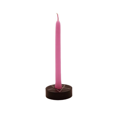 pink  tiny taper candle in a pentacle candle holder