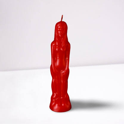 red naked figure candle in the shape of a naked female- front on- on a white background