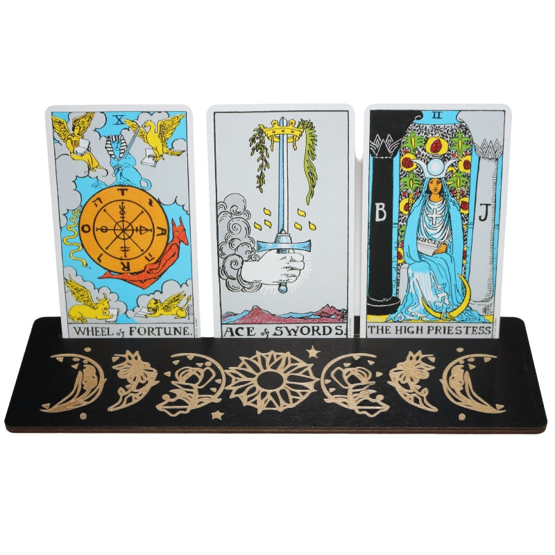 3 tarot cards in a black tarot card holder