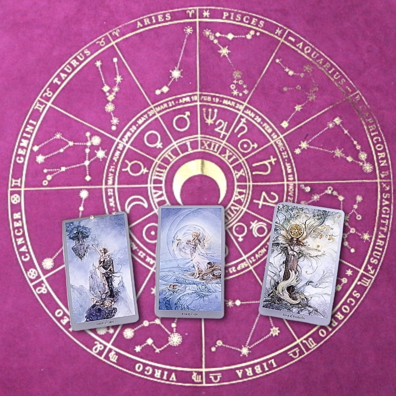 purple and gold printed tarot cloth printed with astrological signs  with 3 tarot cards laid on top
