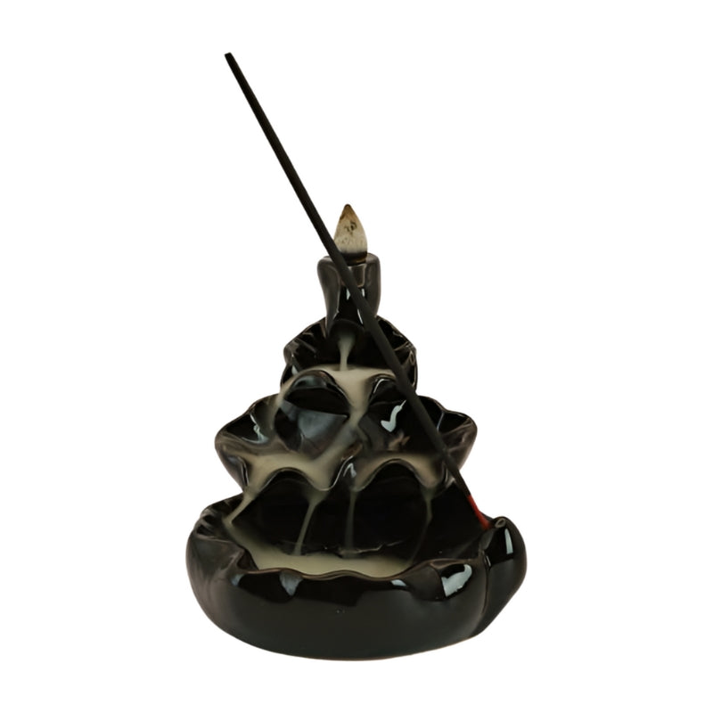 Ceramic Waterfall Backflow Incense Cone Burner with a sitck incense in front and smoke billowing down the front