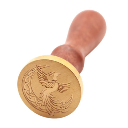 Brass head of a wax seal stamp with a phoenix design and wooden handle