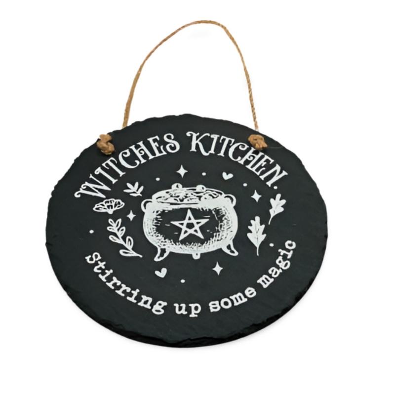 black slate sign with a rope handle.  White cauldron painted on the front of the sign with a pentagram 