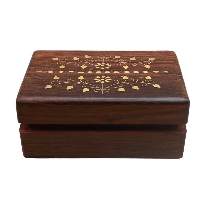 Wooden box with decorative floral pattern on a white background